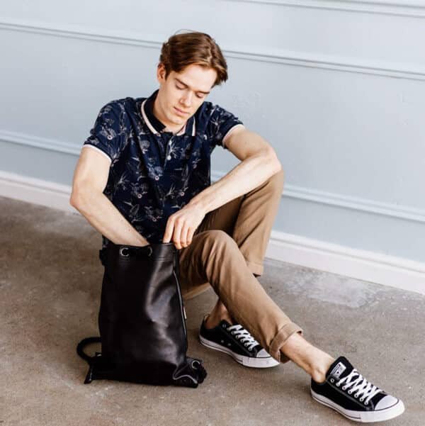 black leather drawstring backpack