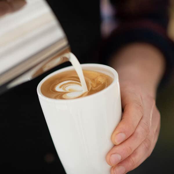 white porcelain travel mug